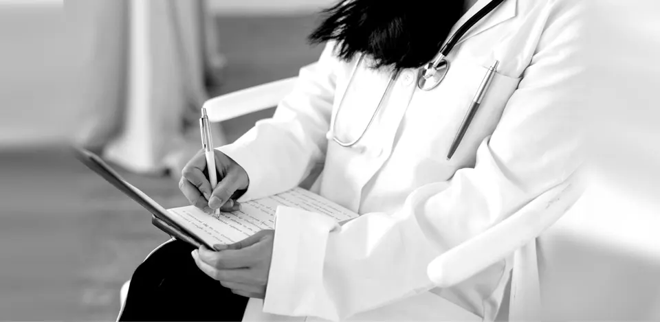 Doctor planning a therapy during a visit